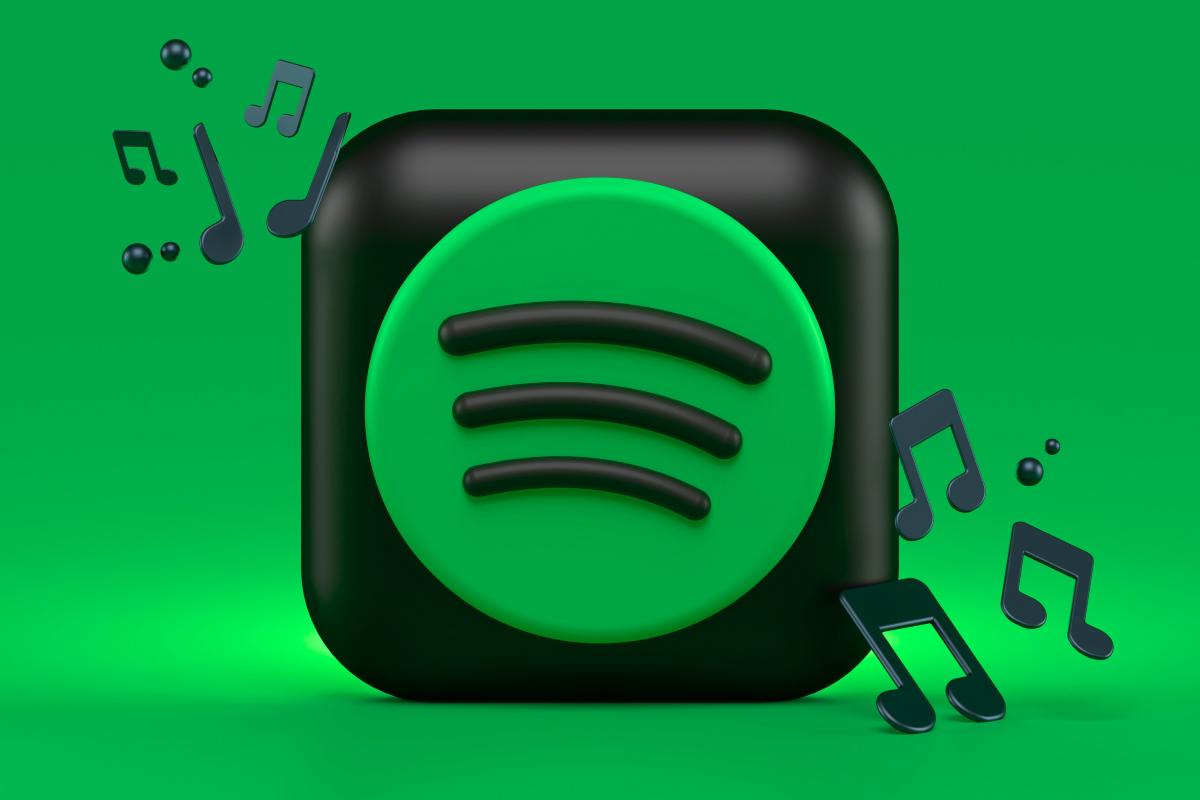 Logo di Spotify 3D con note musicali su sfondo verde